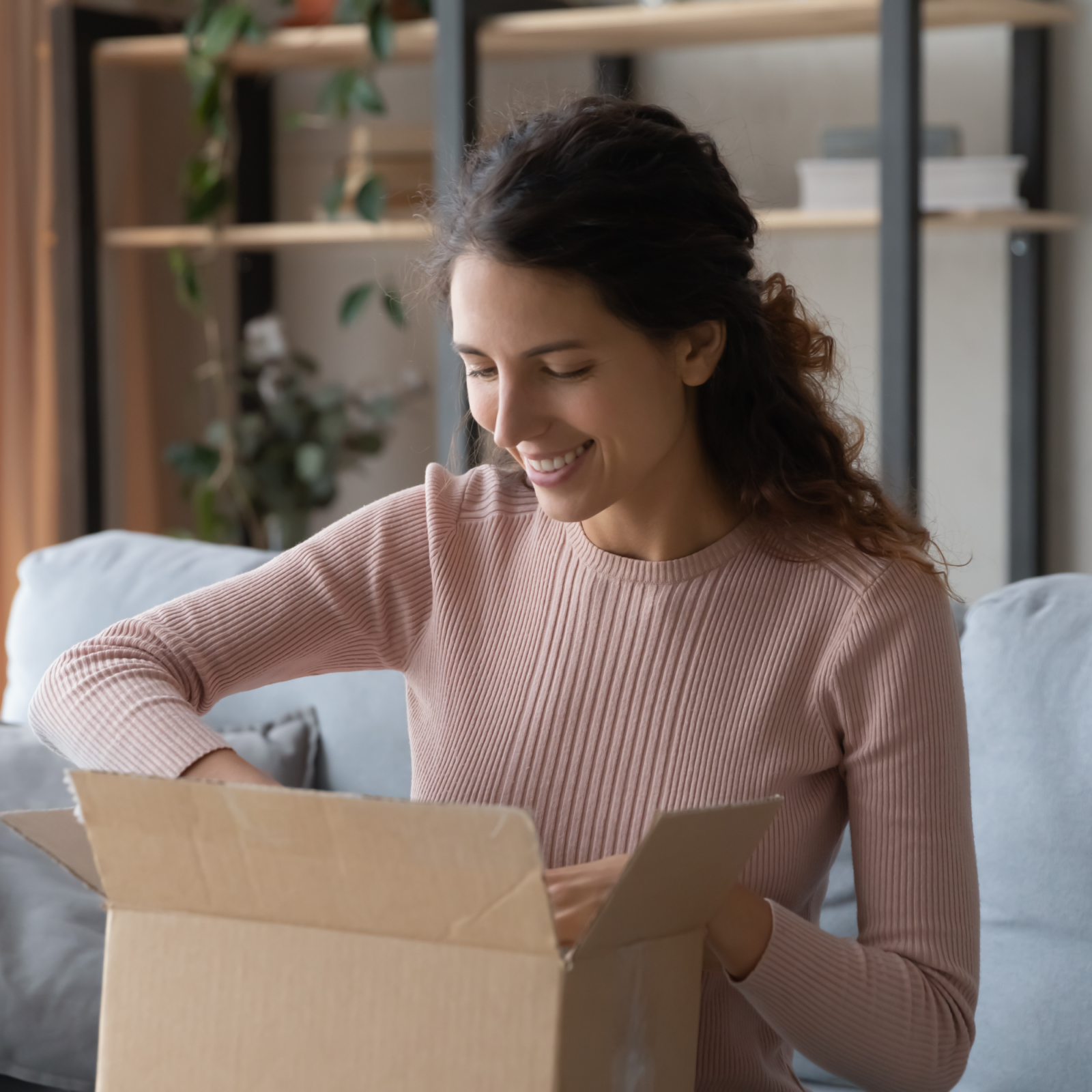 consumer opening up a package at home
