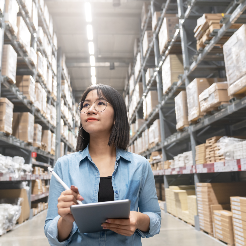 Operational employee at warehouse checking inventory