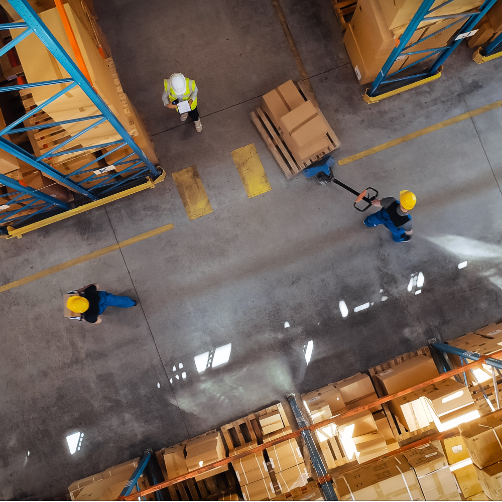 Warehouse workers walking into a warehouse